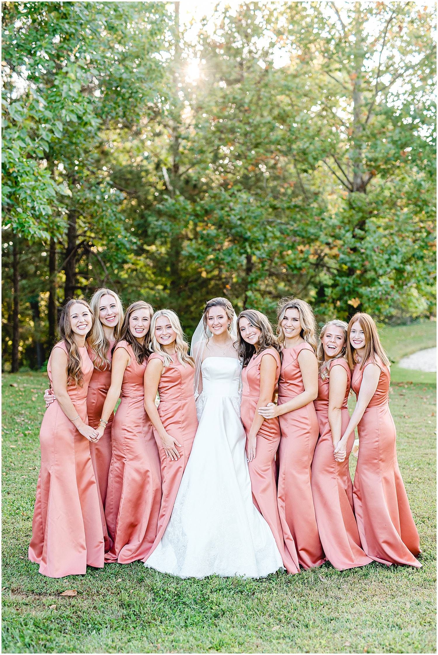 bride and bridesmaids smile during wedding party portraits at les bourgeois winery wedding