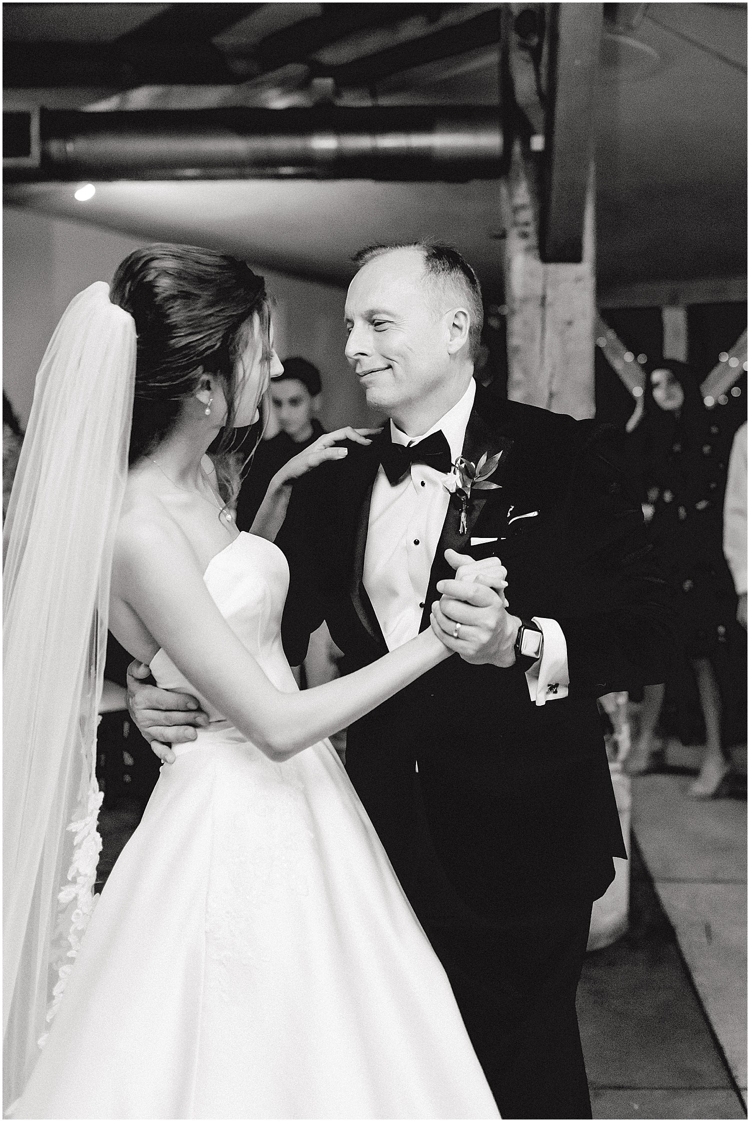 black and white image of bride and dad dancing during wedding reception