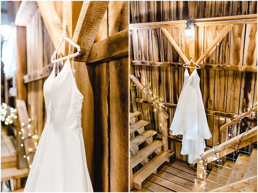 bridal gown hanging on wall of barn