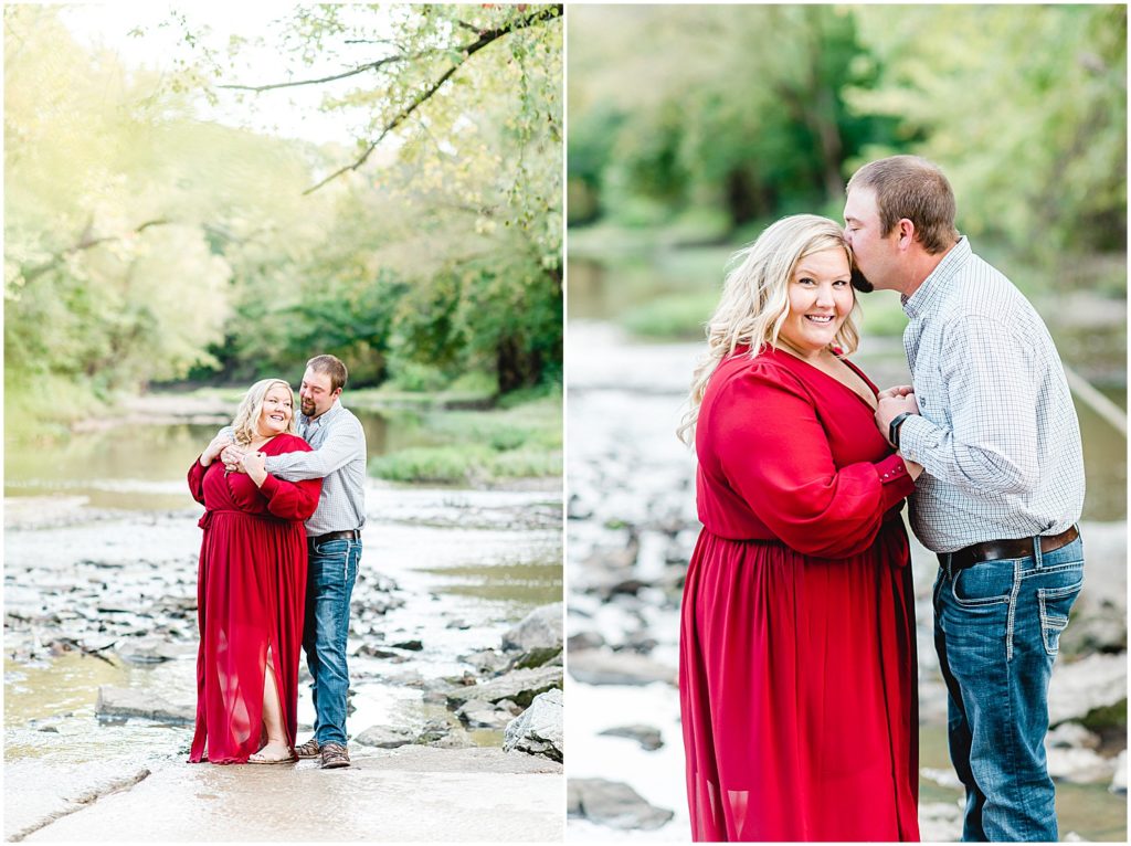 Couple stands in creek bed posing for camera during Missouri engagement pictures.