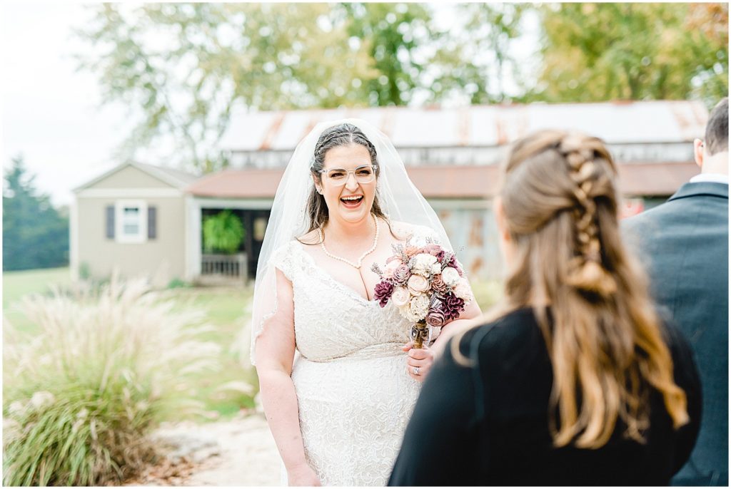 bride smiling at wedding guest after wedding ceremony