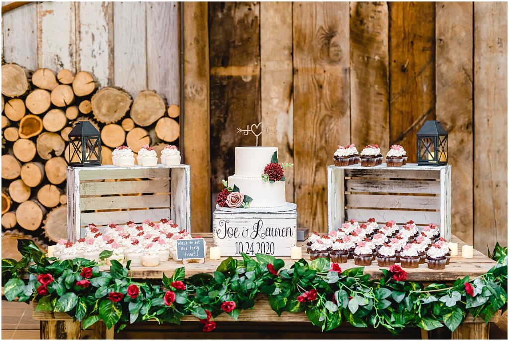 wedding dessert table details of barn wedding with maroon accents