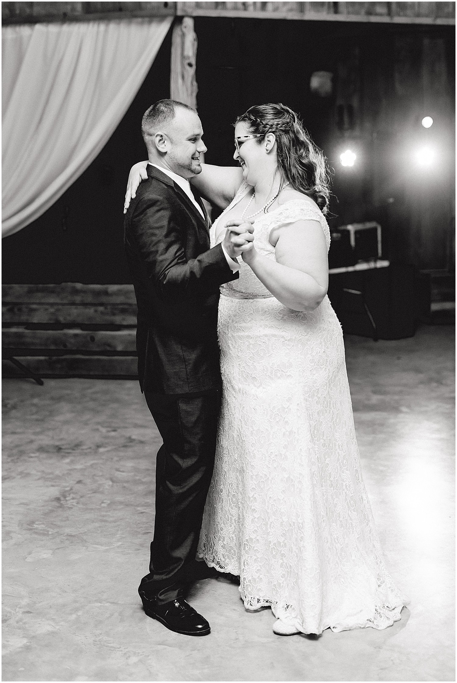 black and white image of bride and groom first dance at wildflower in Eugene, mo