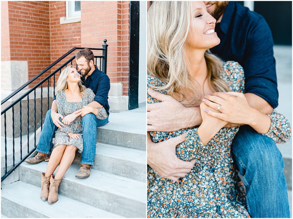 couple snuggles on stairs in front of church during missouri fall engagement session