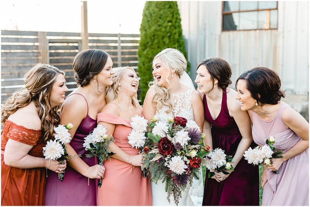bride and bridesmaids laugh together