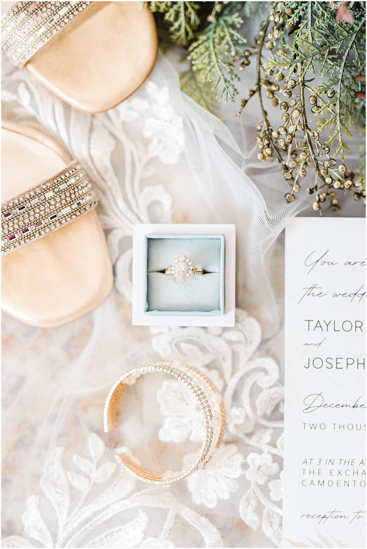 Wedding day flat lay details featuring gold jewelry
