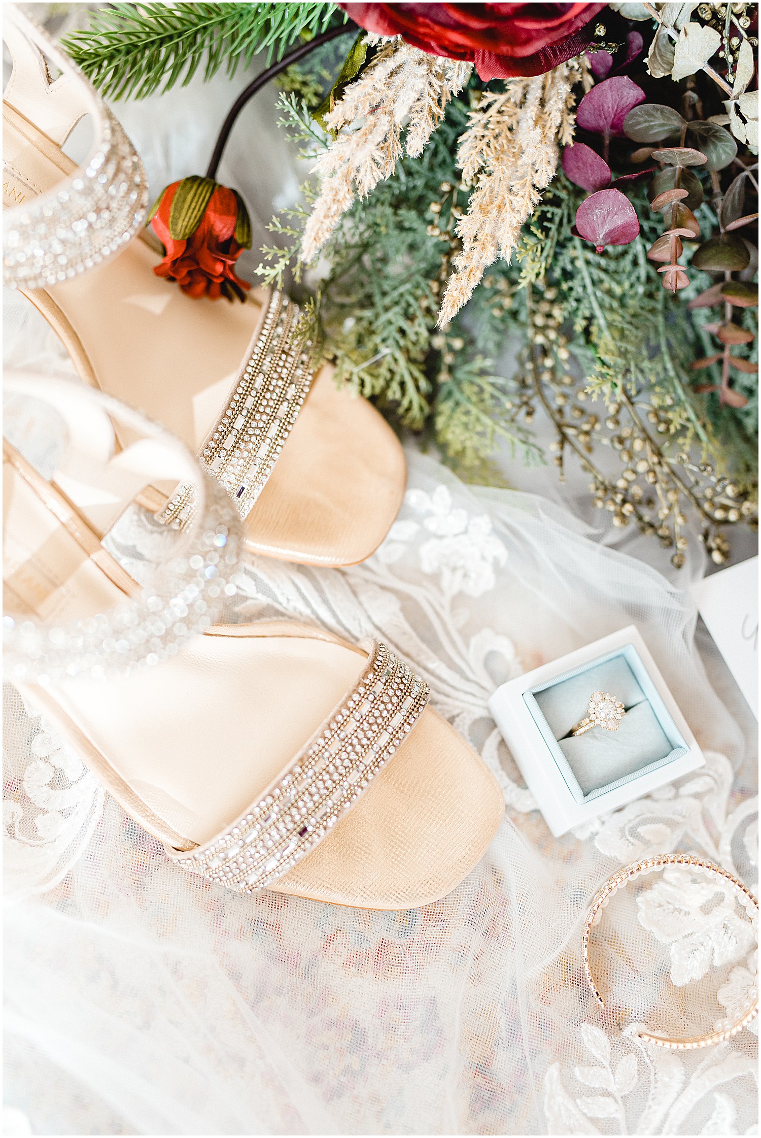 Wedding day flat lay details featuring gold jewelry and champagne shoes
