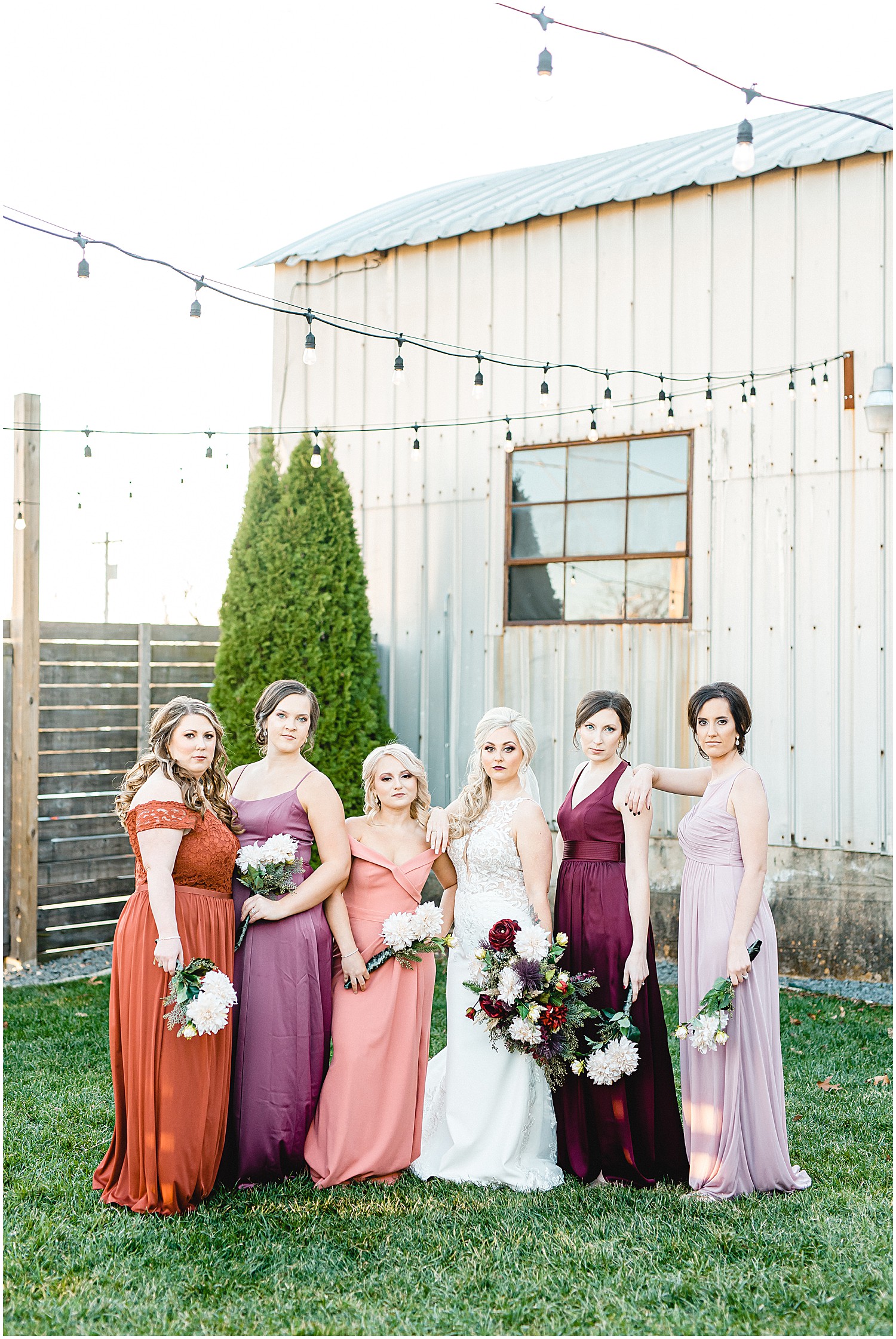 bride and bridesmaids posing for wedding party photos