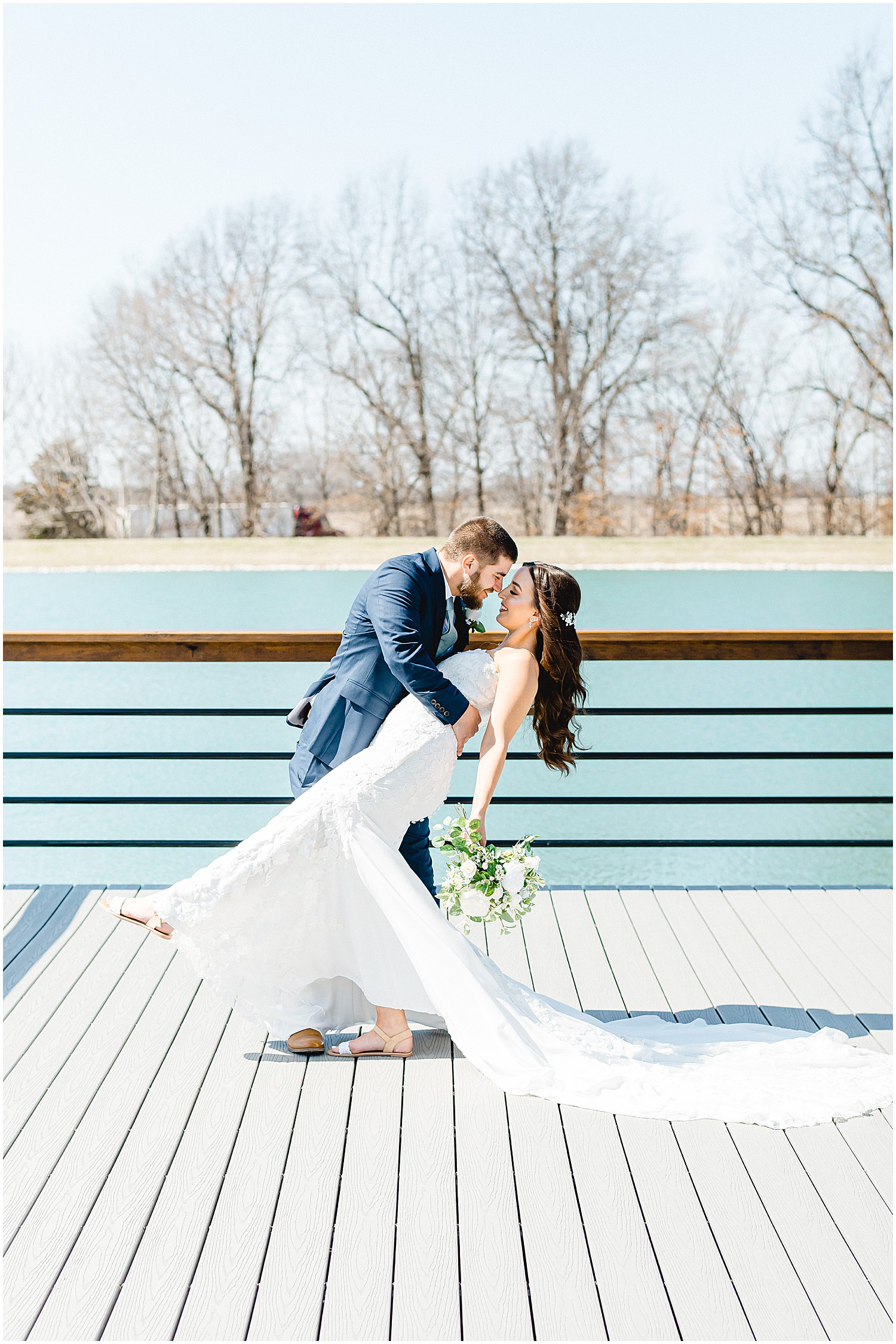 First look with bride and groom on the dock at Emerson Fields missouri wedding venue