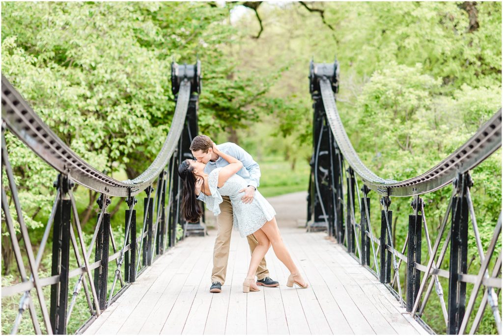 forest park engagement session kissing on old steel bridge