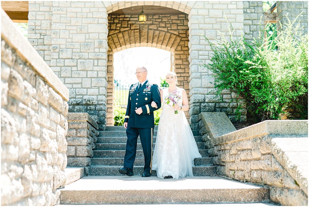 bride and father walk down steps at governor's garden.