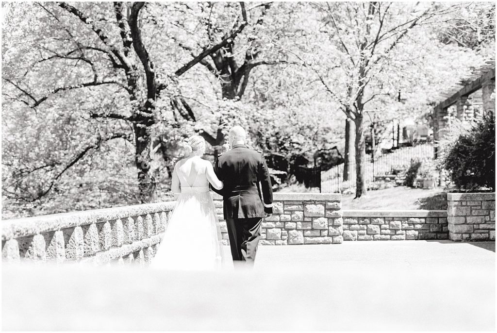 bride and father walk at governor's garden