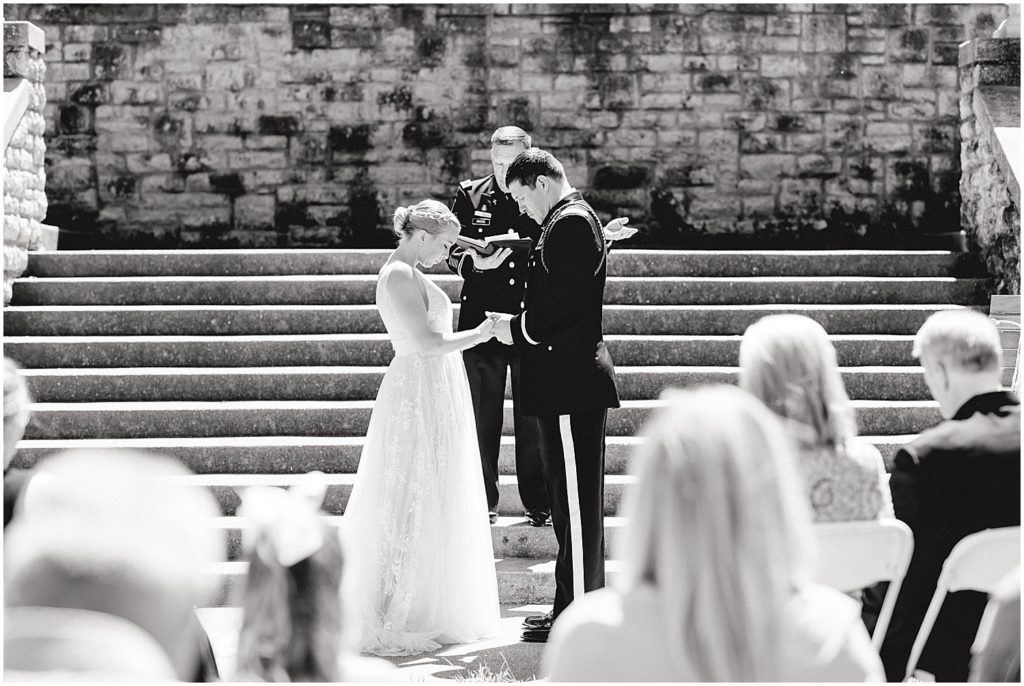 bride and groom pray during intimate wedding ceremony