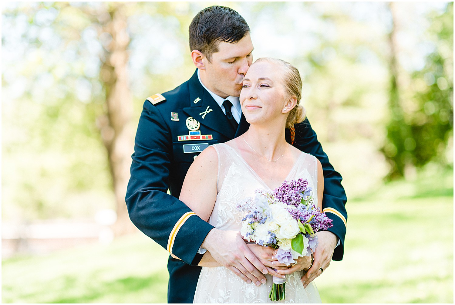 bride and groom kiss at missouri governor's garden wedding