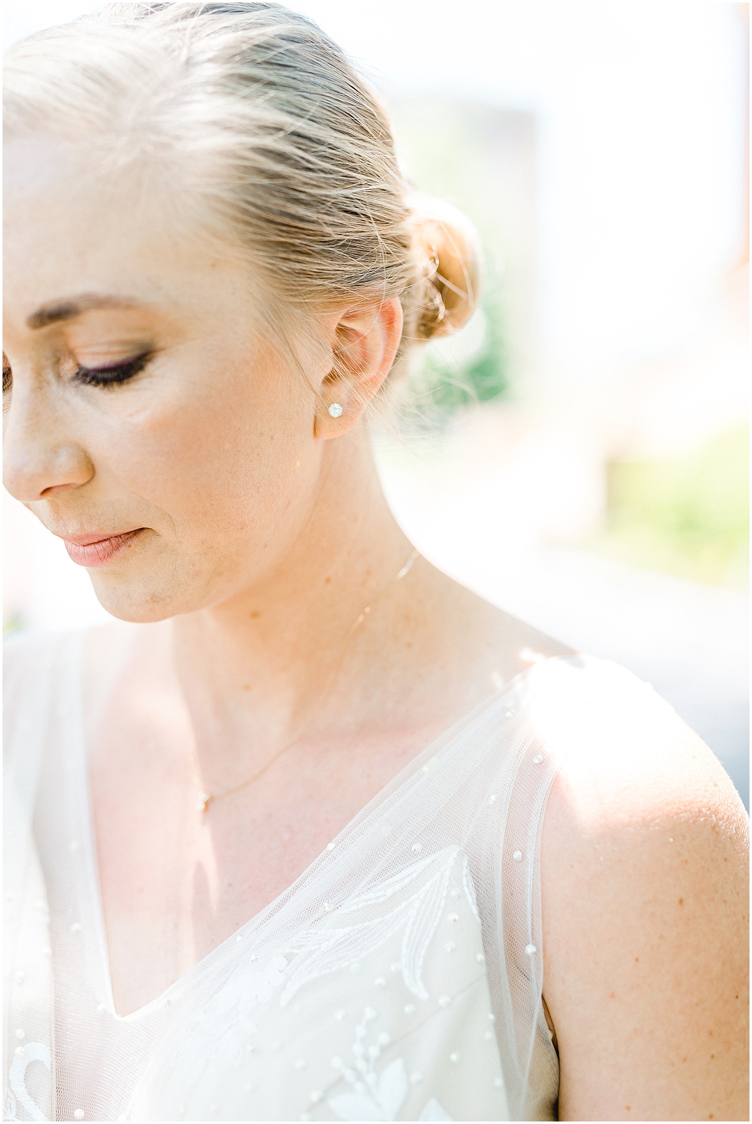 bride earring details during wedding party portraits