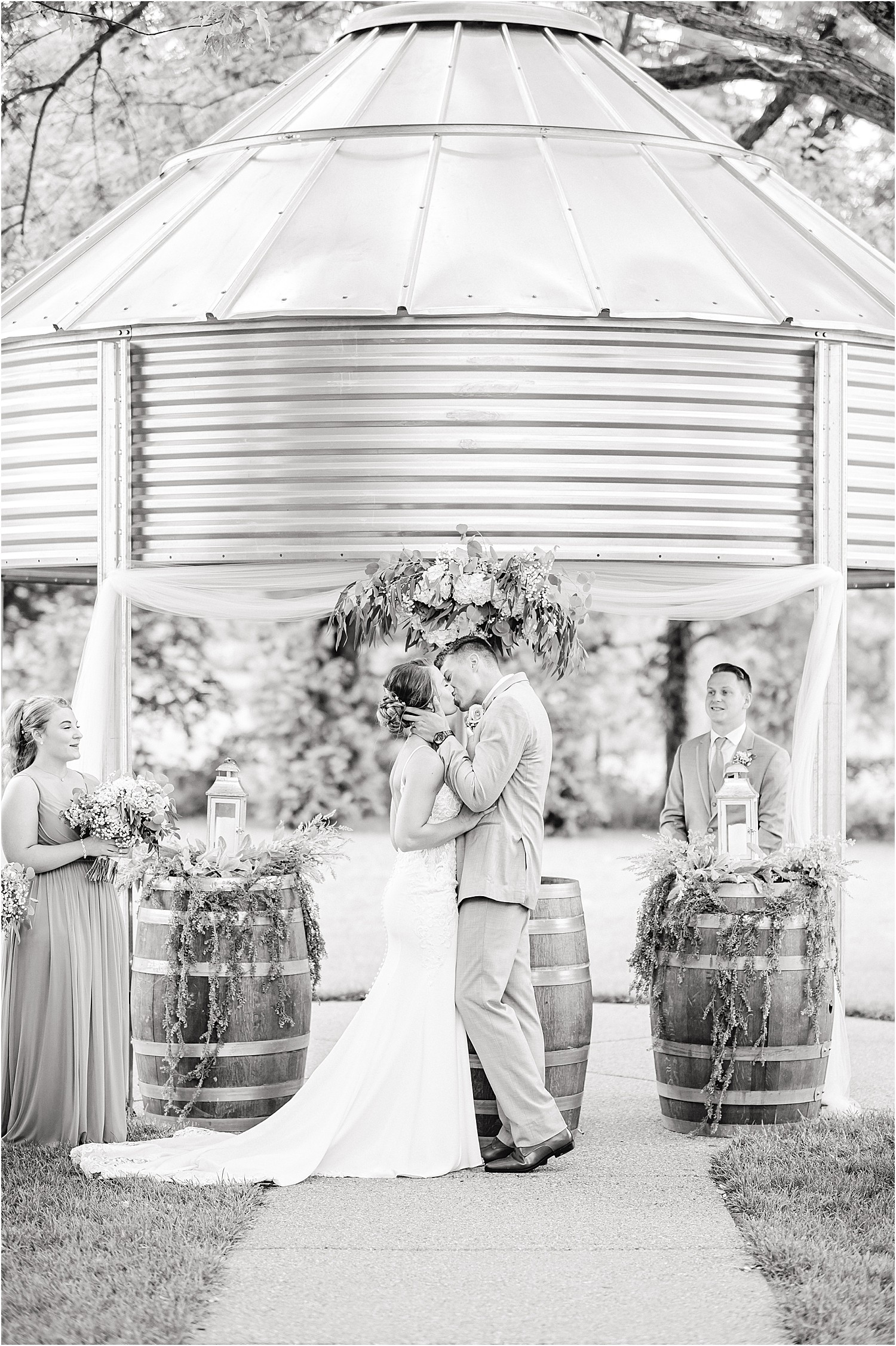 outdoor wedding ceremony at sweet clover farms black and white first kiss